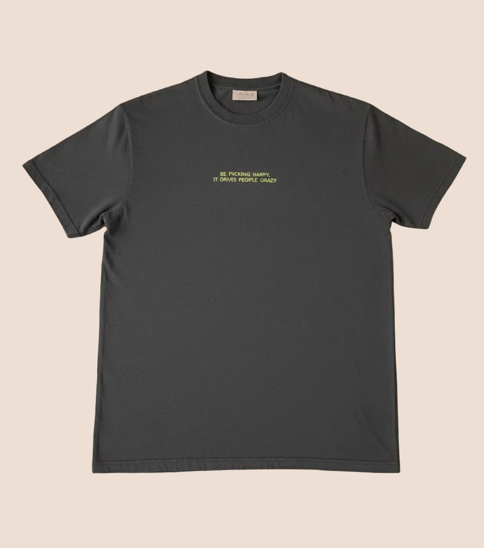 Black t-shirt with yellow text on a brown background