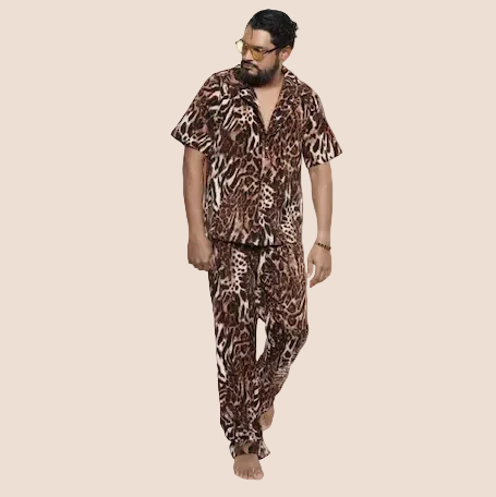 Man wearing a leopard print outfit on a beige background